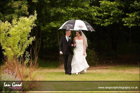 walking in the rain at Basingstoke wedding