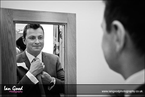 groom prepares at Oakley Hall wedding