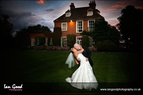 Bride and groom kiss at Hook House Hotel wedding