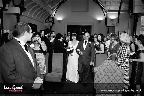 Bride walsk up the aisle at Audleys Wood