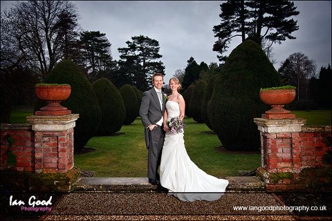 Bride and groom in the grounds of the Elvetham Hotel