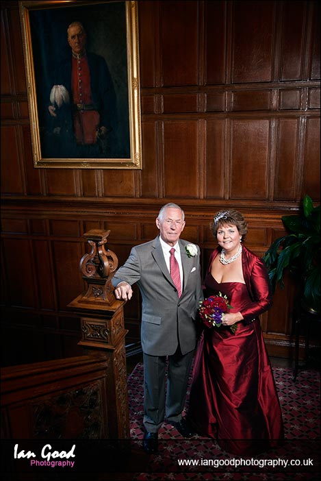 Bride and father on the stairs at Tylney Hall