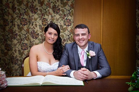 bride and groom at manor gatehouse wedding