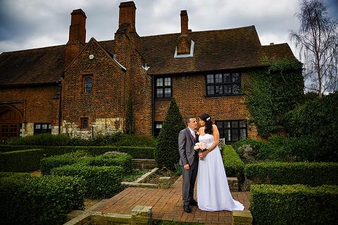 happy couple outside manor gatehouse