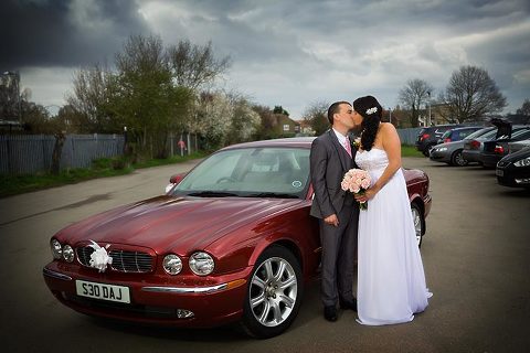 couple with car at kent wedding