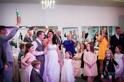 toasting the bride and groom