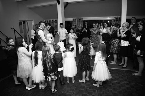 bride and groom cut the cake