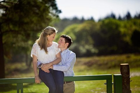 couple looking at each other on new forest engagement shoot