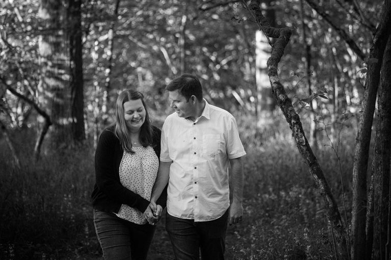 pre-wedding couple walking in woods at Basingstoke in black and white