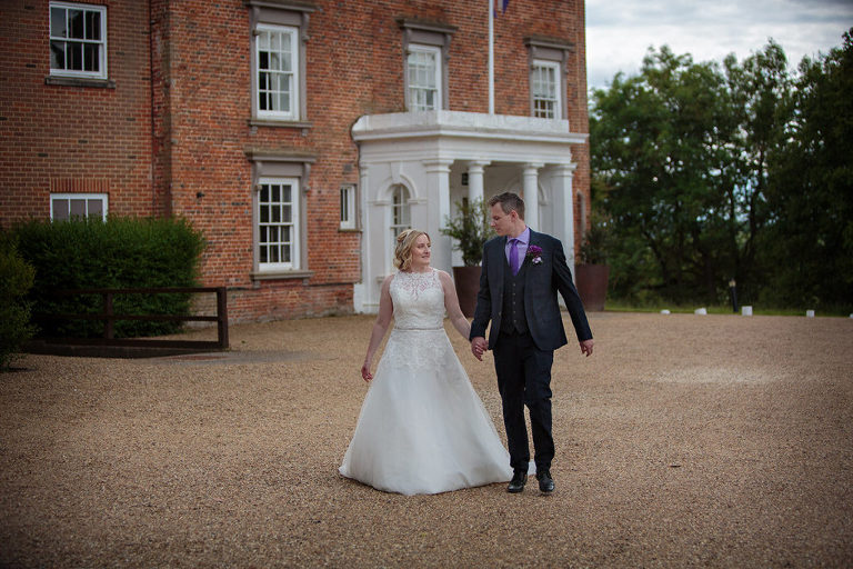 wedding couple walking outside highfield park hotel
