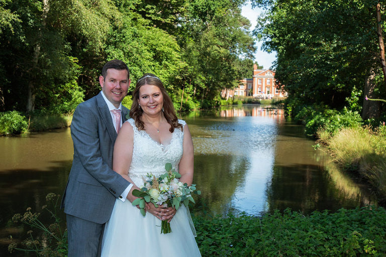 wedding photography at Warbrook House Hotel  - bride & groom by lake