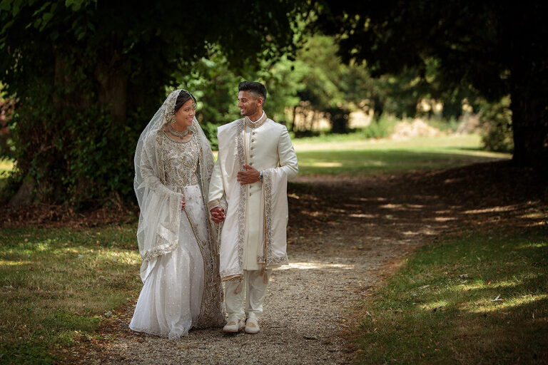 Oakley Hall wedding photographer - couple walking