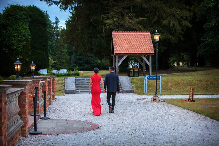 couple walking at oakley hall wedding