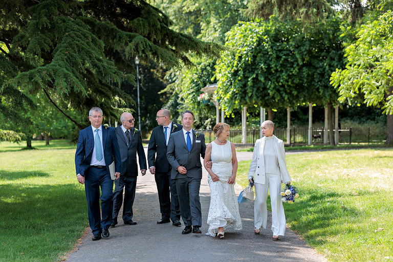 walking with guests at intimate wedding in Basingstoke registry office