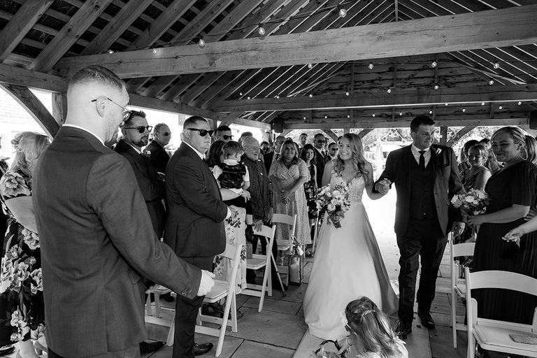 Outdoor wedding ceremony in the rose garden at The Wellington Arms